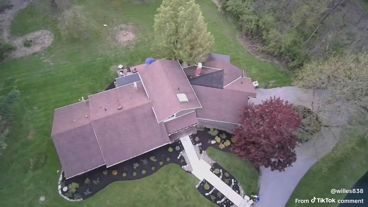 Aerial view of a property with fresh mulch landscaping